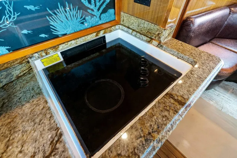 Knot On Call Yacht Photos Pics Granite countertop with built-in stove on 2006 Viking 61 Convertible yacht.