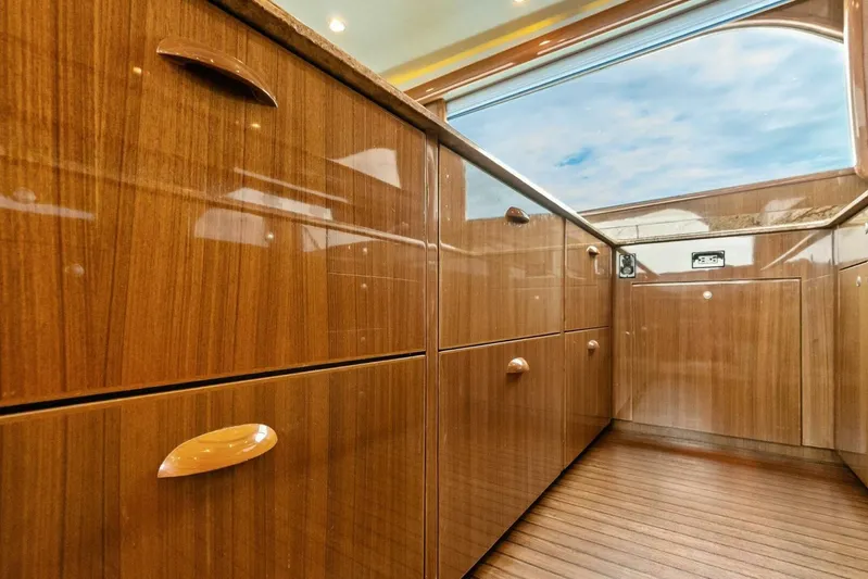 Knot On Call Yacht Photos Pics Luxurious wood cabinetry in 2006 Viking 61 Convertible yacht interior.
