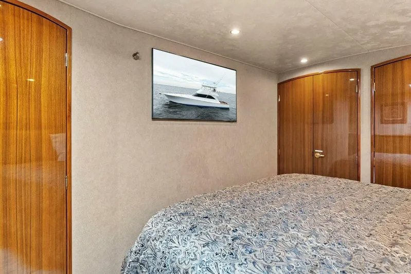 Knot On Call Yacht Photos Pics Luxurious cabin interior of 2006 Viking 61 Convertible yacht with elegant wood finishes.