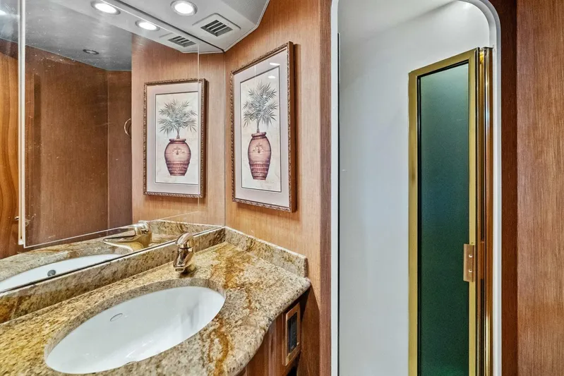 Knot On Call Yacht Photos Pics Luxurious bathroom in 2006 Viking 61 Convertible yacht with granite countertop and elegant decor.