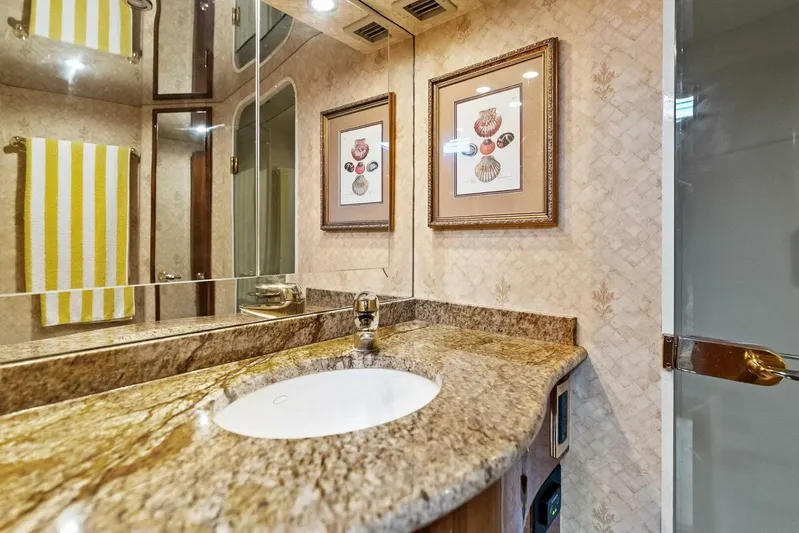 Knot On Call Yacht Photos Pics Luxurious bathroom in 2006 Viking 61 Convertible yacht with granite countertop and elegant decor.