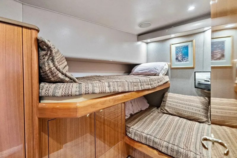 Knot On Call Yacht Photos Pics Interior of 2006 Viking 61 Convertible yacht with cozy bunk beds and elegant wood finish.