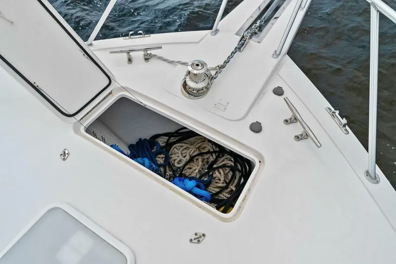 Knot On Call Yacht Photos Pics Anchor locker of 2006 Viking 61 Convertible yacht with ropes and chain.