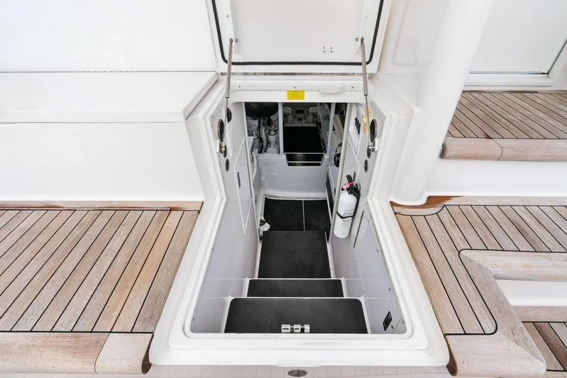 Knot On Call Yacht Photos Pics Engine room access on 2006 Viking 61 Convertible yacht with teak deck.