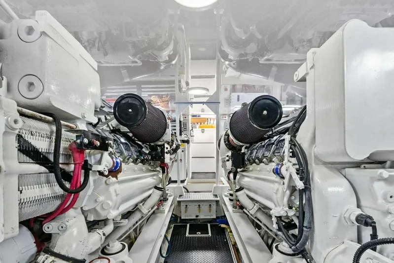 Knot On Call Yacht Photos Pics Engine room of a 2006 Viking 61 Convertible yacht, showcasing dual engines.