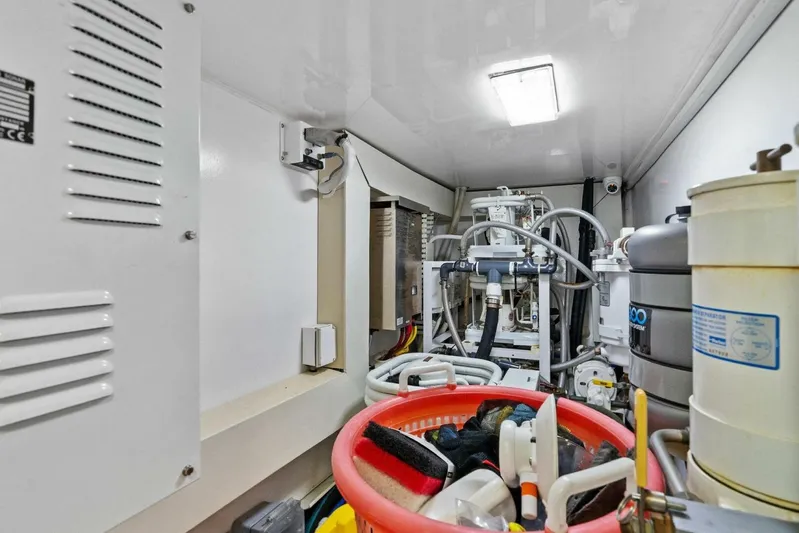 Knot On Call Yacht Photos Pics Engine room of 2006 Viking 61 Convertible yacht with mechanical equipment and storage.