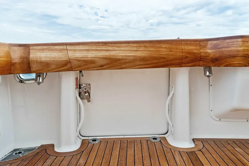 Knot On Call Yacht Photos Pics 2006 Viking 61 Convertible yacht with teak deck and polished wood railing.