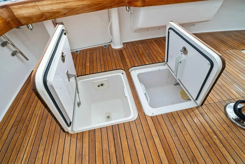 Knot On Call Yacht Photos Pics Open storage compartments on 2006 Viking 61 Convertible yacht with teak flooring.