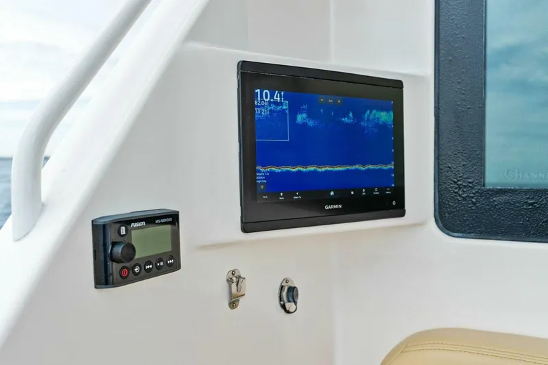 Knot On Call Yacht Photos Pics Garmin display and Fusion stereo on 2006 Viking 61 Convertible yacht dashboard.