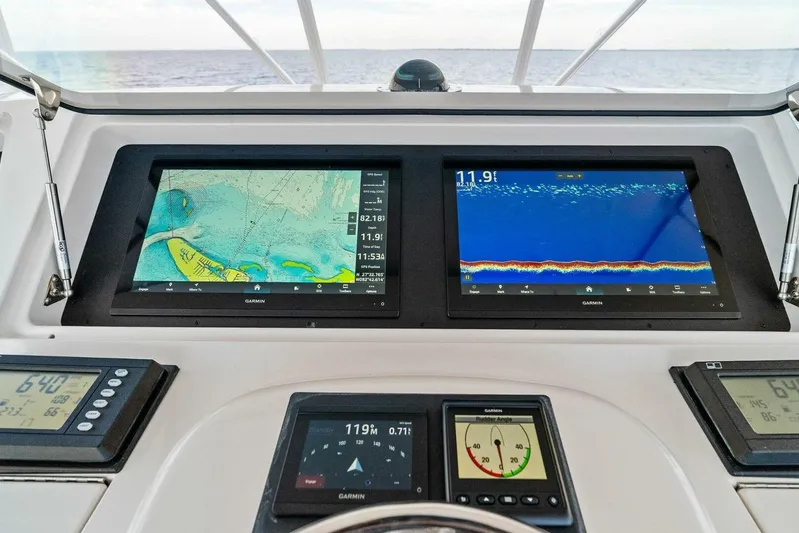 Knot On Call Yacht Photos Pics Navigation and sonar displays on a 2006 Viking 61 Convertible yacht dashboard.