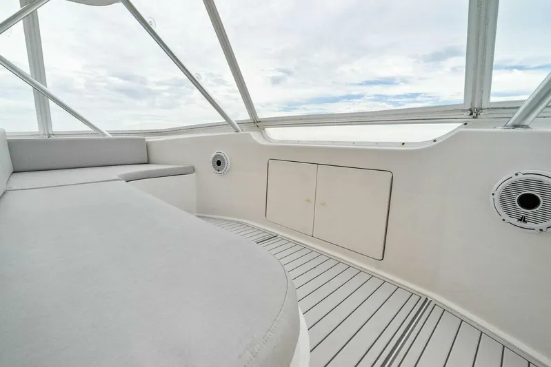 Knot On Call Yacht Photos Pics 2006 Viking 61 Convertible yacht interior with cushioned seating and sleek design.