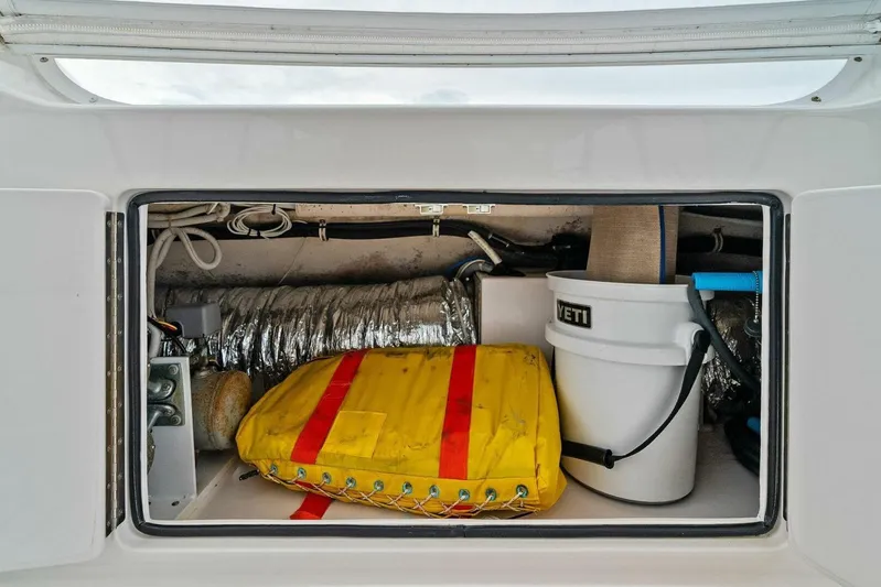 Knot On Call Yacht Photos Pics Storage compartment on a 2006 Viking 61 Convertible boat with equipment and supplies.