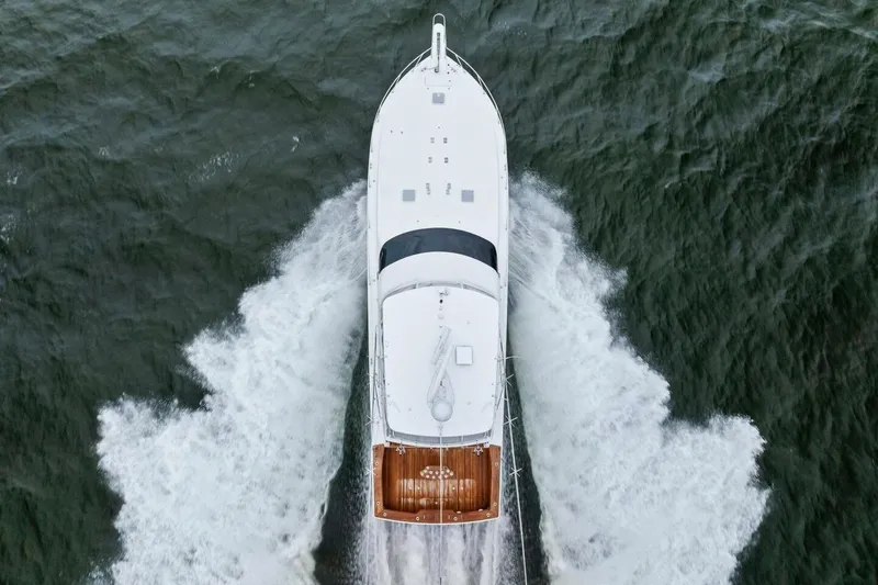 Knot On Call Yacht Photos Pics Aerial view of 2006 Viking 61 Convertible yacht cruising through ocean waves.