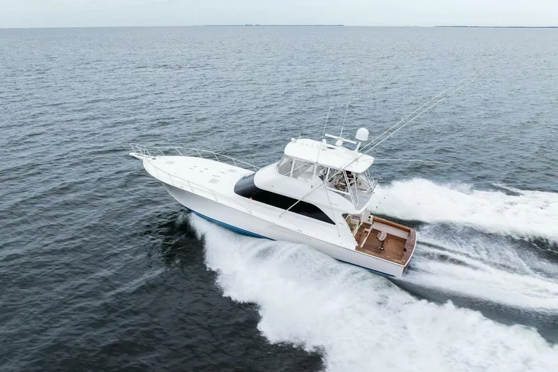 Knot On Call Yacht Photos Pics 2006 Viking 61 Convertible yacht cruising on open water.