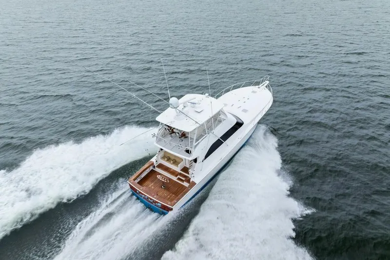 Knot On Call Yacht Photos Pics Aerial view of 2006 Viking 61 Convertible yacht cruising on open water.