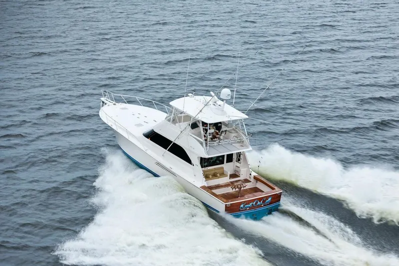 Knot On Call Yacht Photos Pics 2006 Viking 61 Convertible yacht cruising on open water.