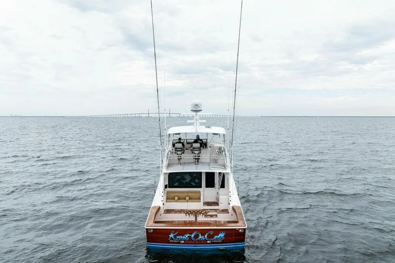 Knot On Call Yacht Photos Pics 2006 Viking 61 Convertible yacht on open water under cloudy sky.