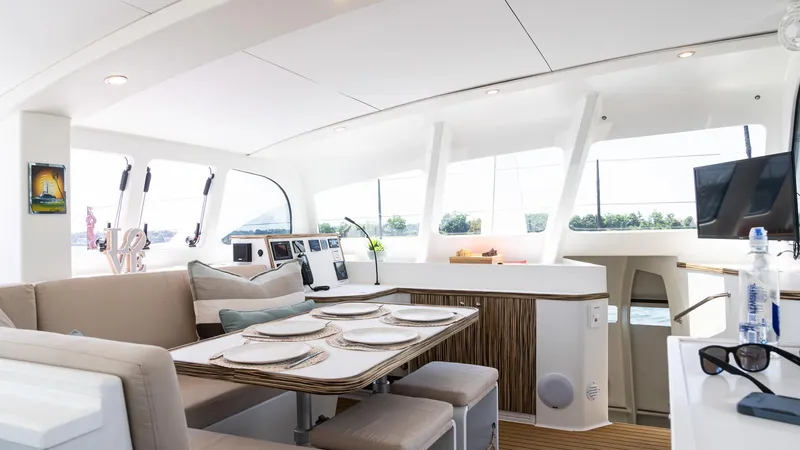 Nohea Yacht Photos Pics Luxurious interior of 2022 Custom Current Marine 46 yacht with elegant dining area.