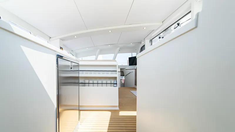 Nohea Yacht Photos Pics Interior of 2022 Custom Current Marine 46 yacht with modern design and wooden flooring.