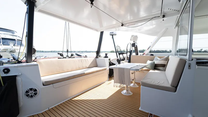 Nohea Yacht Photos Pics Luxurious interior of 2022 Custom Current Marine 46 yacht with comfortable seating and modern design.