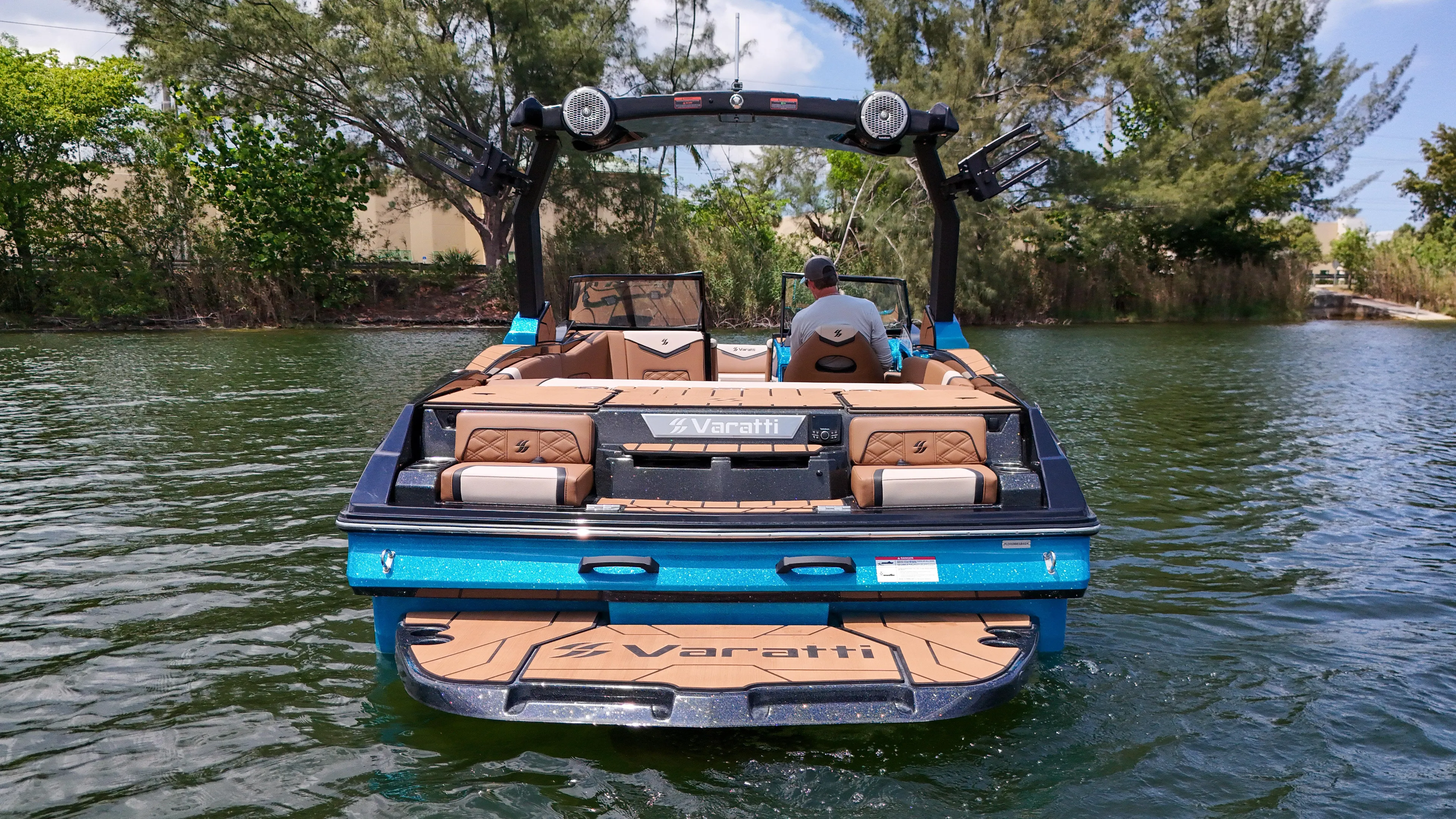  Yacht Photos Pics 2024 Varatti Z2373 boat on a lake, rear view with lush greenery.