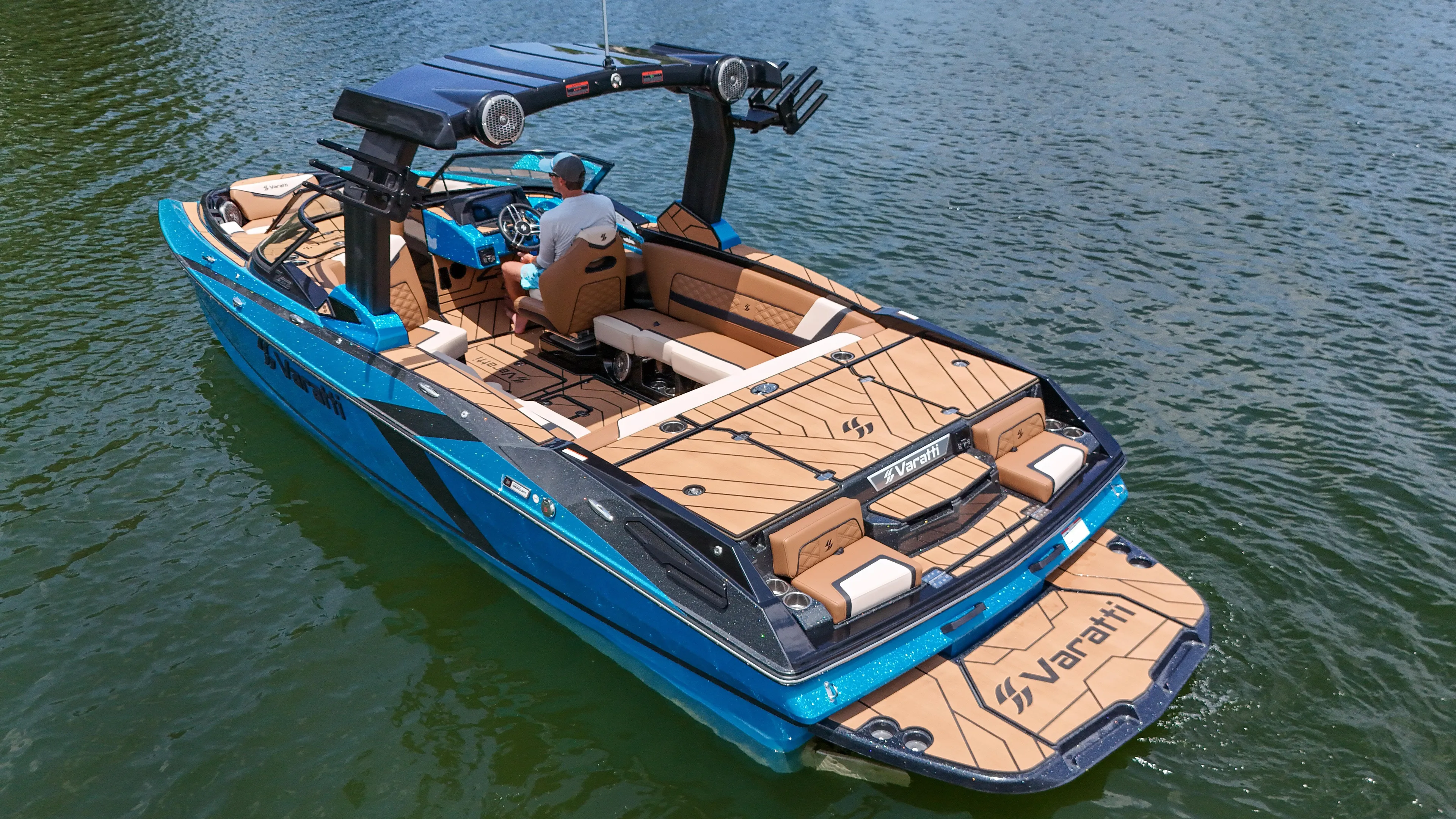  Yacht Photos Pics 2024 Varatti Z2373 boat cruising on a lake with a person at the helm.