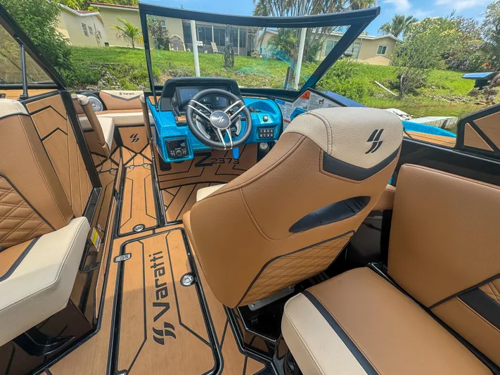  Yacht Photos Pics 2024 Varatti Z2373 boat interior with tan seats and modern dashboard.