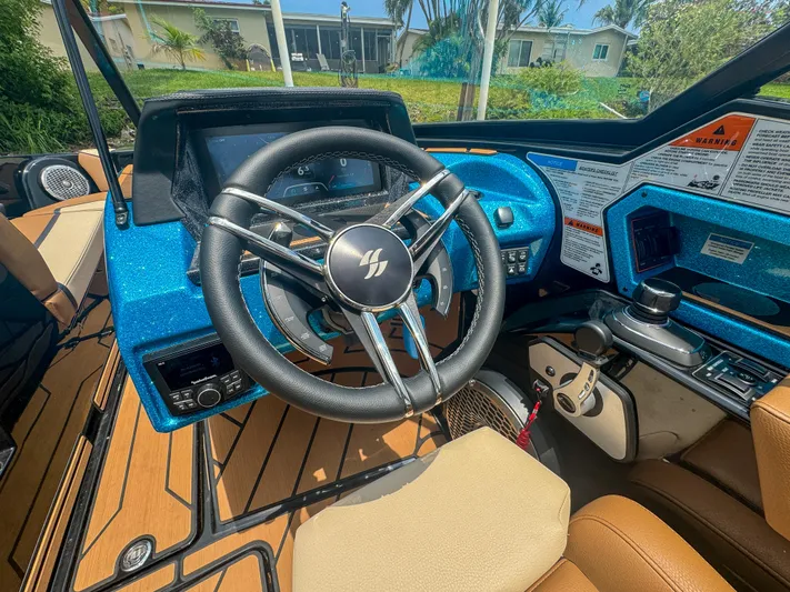  Yacht Photos Pics 2024 Varatti Z2373 boat dashboard with steering wheel and control panel.