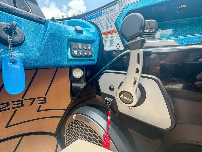  Yacht Photos Pics 2024 Varatti Z2373 boat dashboard with control panel and throttle lever.