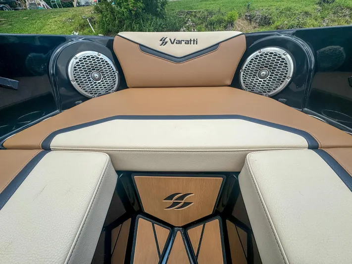  Yacht Photos Pics 2024 Varatti Z2373 boat interior with tan and black seating and built-in speakers.