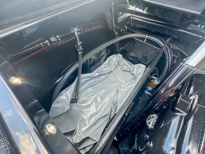  Yacht Photos Pics 2024 Varatti Z2373 boat interior compartment with hoses and equipment.