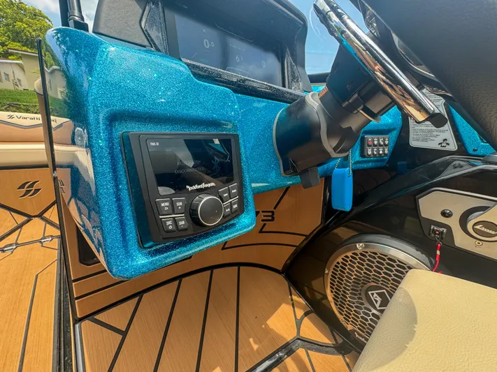 Yacht Photos Pics 2024 Varatti Z2373 boat dashboard with Rockford Fosgate audio system and steering wheel.