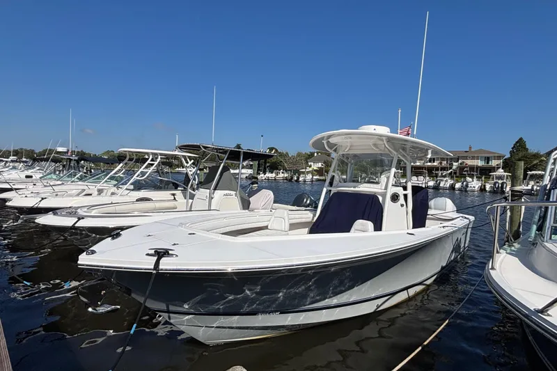  Yacht Photos Pics 2017 Regulator 28 boat docked in a marina under clear blue skies.