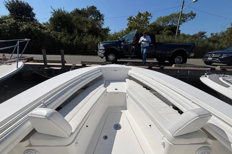  Yacht Photos Pics 2017 Regulator 28 boat interior with docked pickup truck in background.