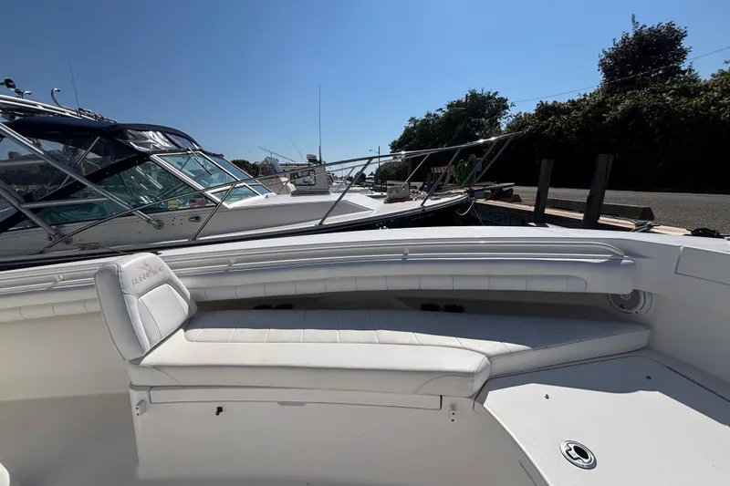  Yacht Photos Pics 2017 Regulator 28 boat with white seating, docked under clear blue sky.