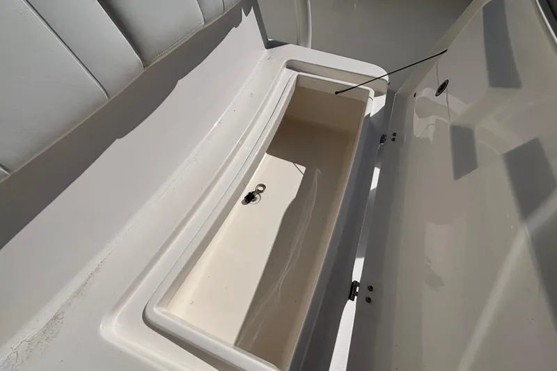  Yacht Photos Pics Open storage compartment on a 2017 Regulator 28 boat, showcasing interior space.