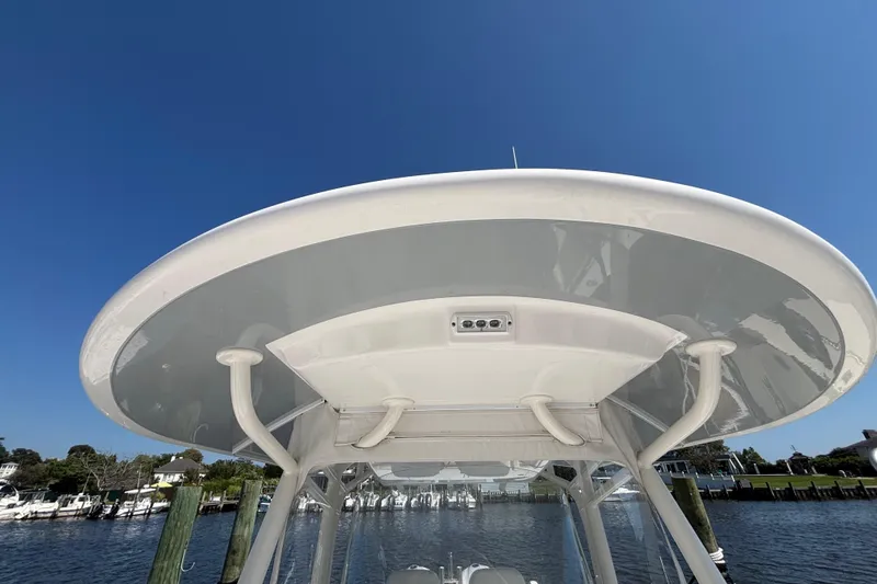  Yacht Photos Pics 2017 Regulator 28 boat's T-top against clear blue sky, dockside view.