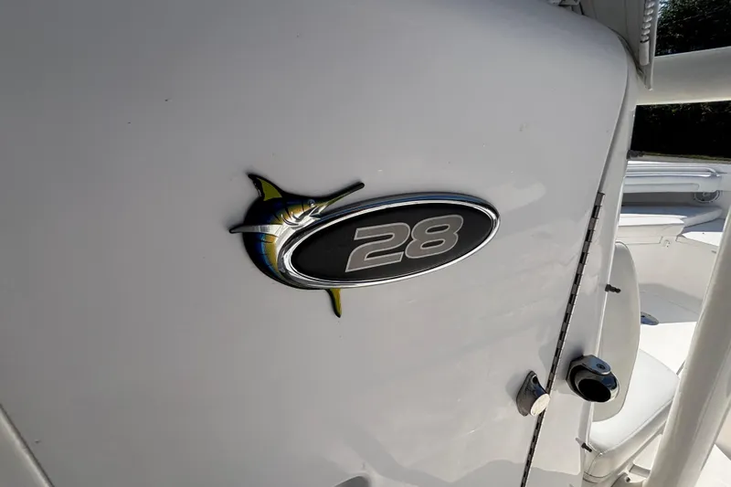  Yacht Photos Pics 2017 Regulator 28 boat emblem on white surface.