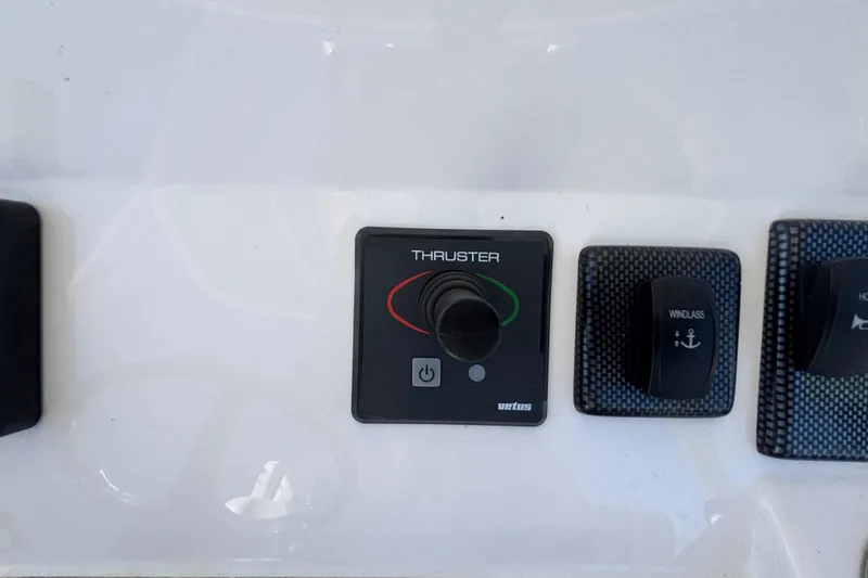  Yacht Photos Pics Control panel of a 2017 Regulator 28 boat featuring thruster and windlass switches.