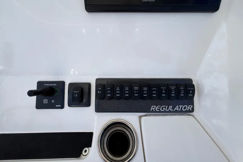  Yacht Photos Pics Control panel of a 2017 Regulator 28 boat with switches and thruster.
