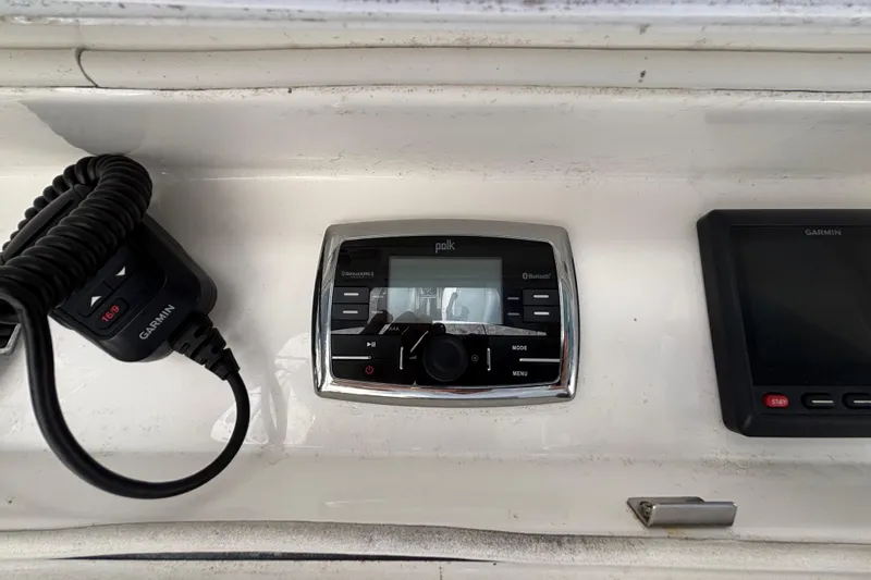  Yacht Photos Pics Control panel of a 2017 Regulator 28 boat featuring Garmin and Polk audio systems.