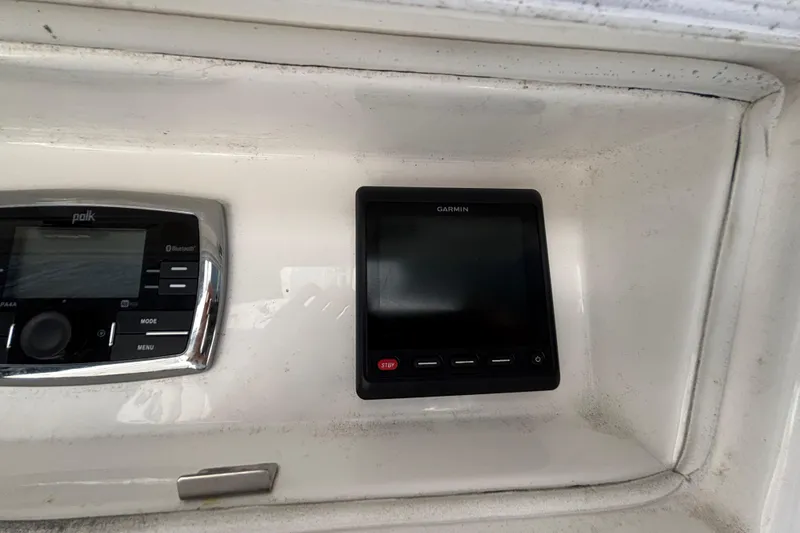  Yacht Photos Pics Control panel of a 2017 Regulator 28 boat featuring Garmin and Polk systems.