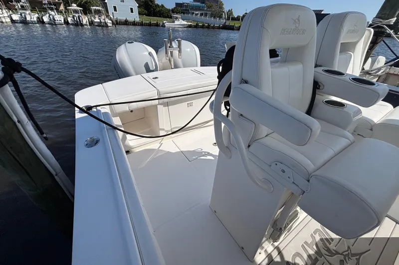  Yacht Photos Pics 2017 Regulator 28 boat interior with white seating and dual outboard motors.