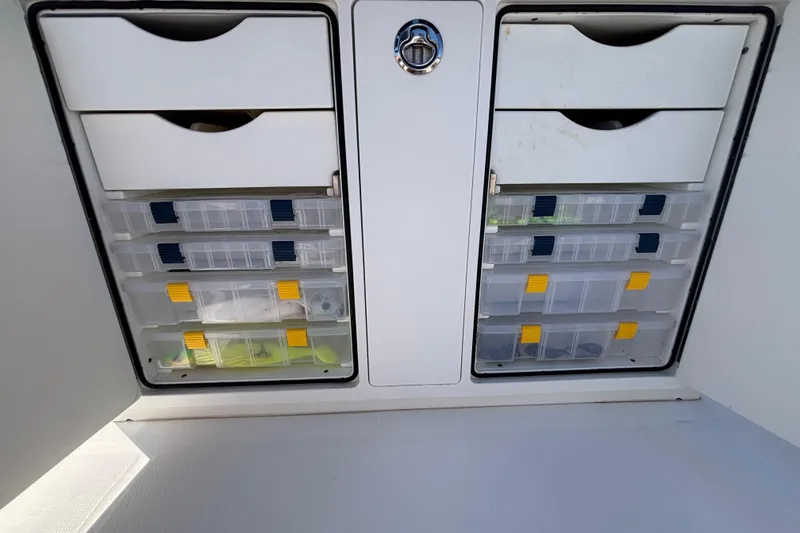  Yacht Photos Pics Storage compartments with tackle boxes on a 2017 Regulator 28 boat.