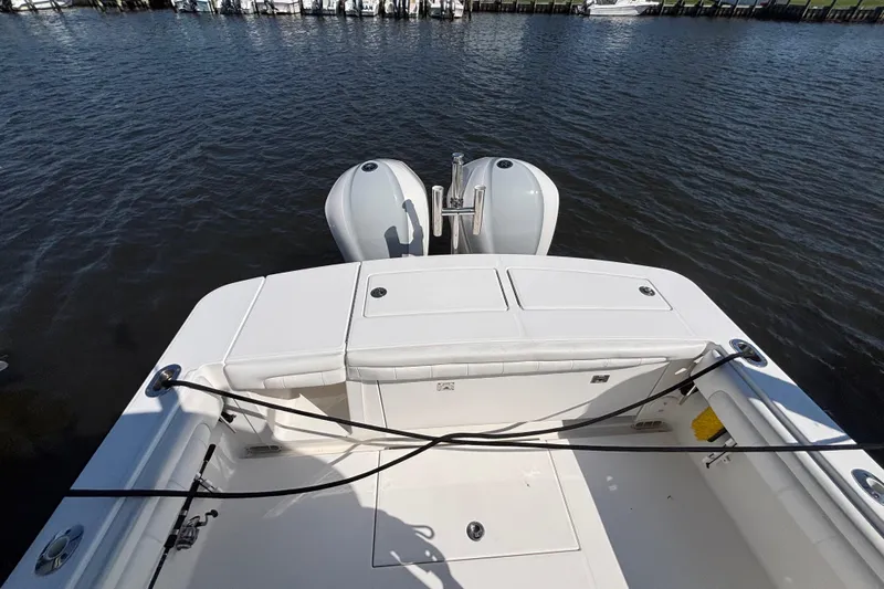  Yacht Photos Pics 2017 Regulator 28 boat with dual outboard motors on calm water.
