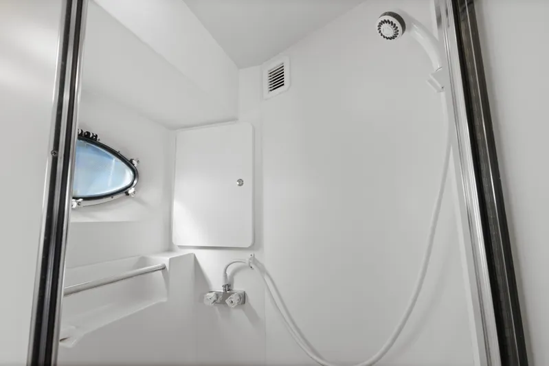  Yacht Photos Pics Bathroom interior of 2000 Silverton 392 Motor Yacht with shower and porthole window.