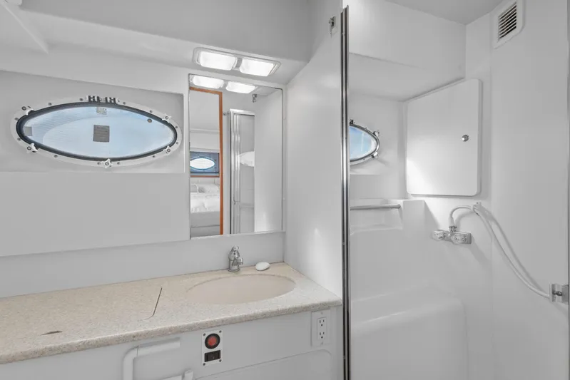  Yacht Photos Pics Bathroom interior of 2000 Silverton 392 Motor Yacht with sink and shower.