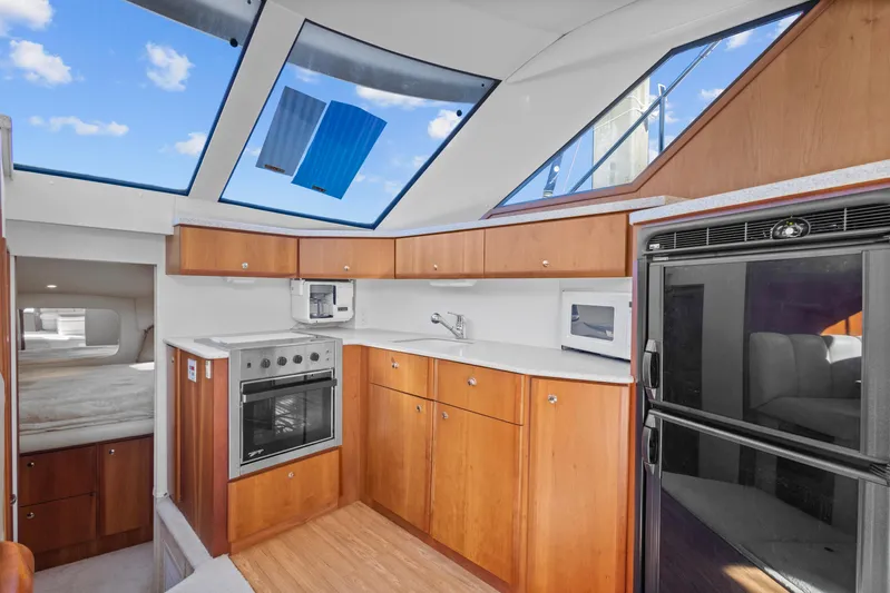  Yacht Photos Pics Interior of 2000 Silverton 392 Motor Yacht with modern kitchen amenities.