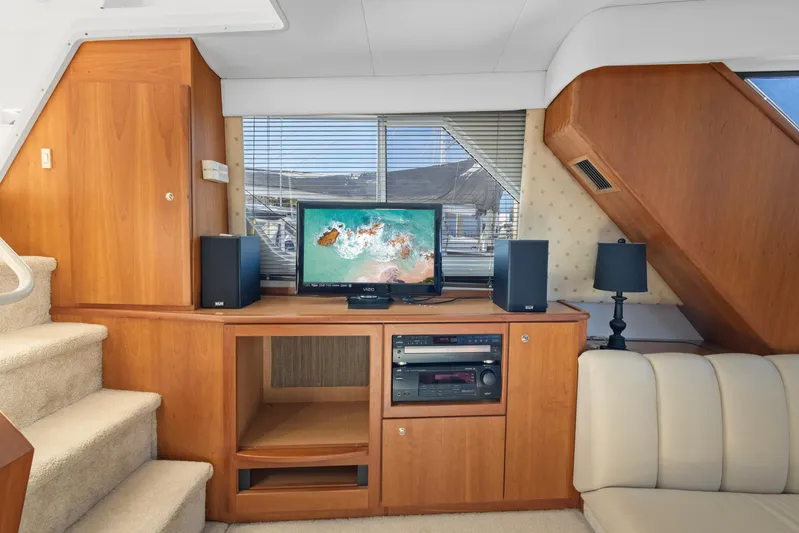  Yacht Photos Pics Interior of 2000 Silverton 392 Motor Yacht with entertainment center and stairs.