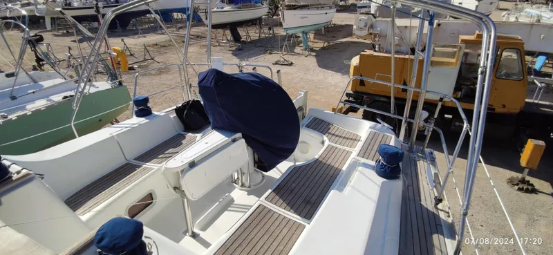  Yacht Photos Pics Beneteau Oceanis Clipper 393 sailboat deck, 2006 model, in a boatyard setting.